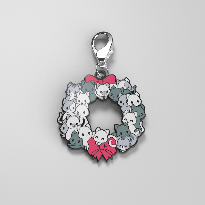 A stylish "Meowy Christmas Wreath Enamel Keychain" featuring TeeTurtle designs of cats nestled in a lovely wreath, perfect for showcasing your personal style.