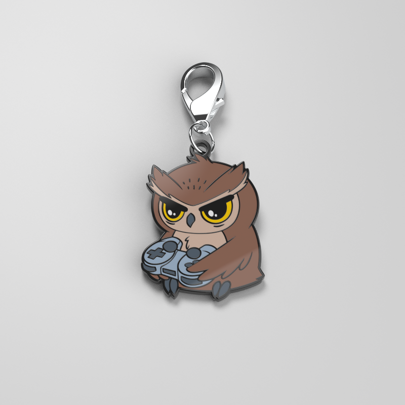A TeeTurtle Night Owl Enamel Keychain showcases one's personal style while holding a controller.