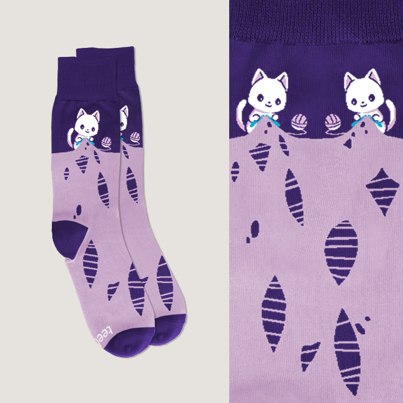 A pair of TeeTurtle Knitting Cat socks.