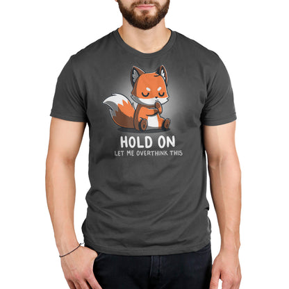 A Let Me Overthink This fox wearing a TeeTurtle charcoal gray t-shirt.