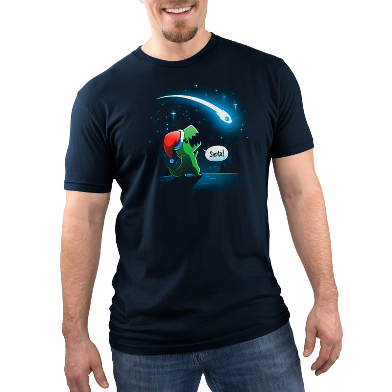 A man wearing a navy blue "Look, Santa!" t-shirt by TeeTurtle with an image of a lizard holding a star.