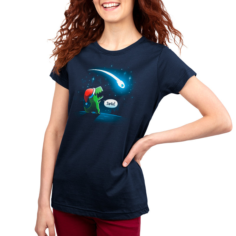 A woman wearing a "Look, Santa!" navy blue t-shirt by TeeTurtle with an image of a lizard and a star.