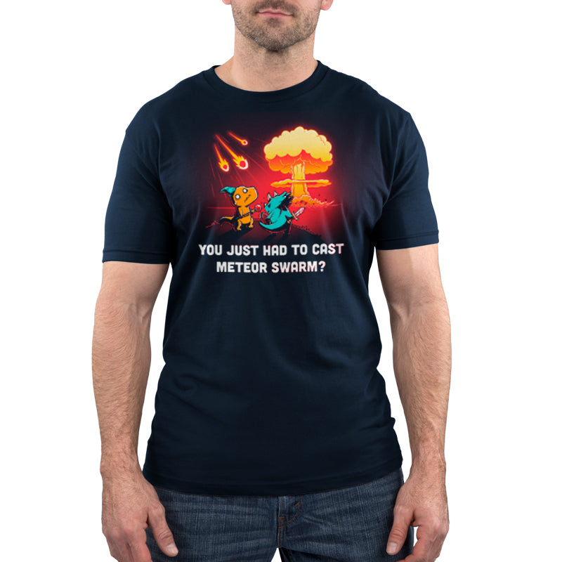 A man wearing a TeeTurtle Meteor Swarm t-shirt in navy blue that says you're going to need a nuclear bomb.