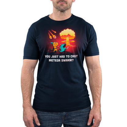 Man wearing a monsterdigital original navy blue T-shirt with a cartoon dinosaur scene and text that reads, "You just had to cast Meteor Swarm?