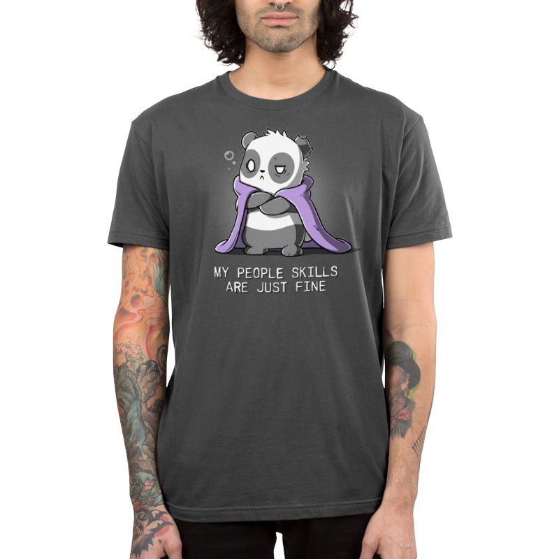 Premium Cotton T-shirt - A person with long hair is donning a charcoal gray apparel made from super soft ringspun cotton, displaying a cartoon panda wrapped in a purple blanket with the text "My People Skills Are Just Fine." The individual also has tattooed arms. The apparel is from the brand monsterdigital and is named My People Skills Are Just Fine.