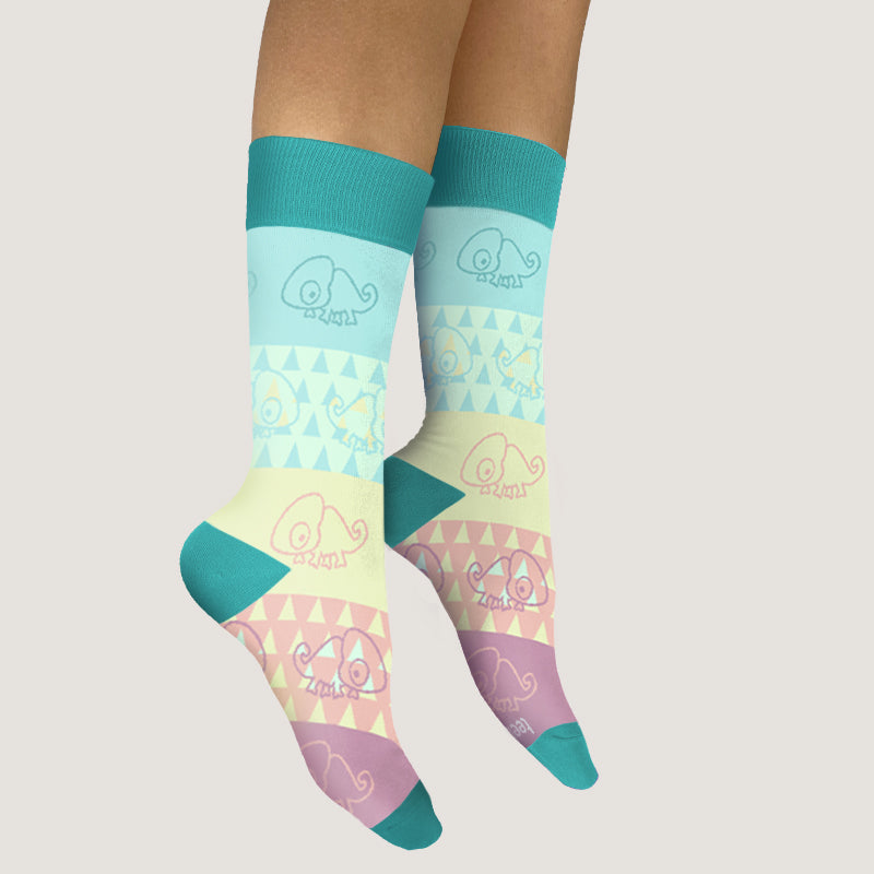 A woman wearing TeeTurtle's Outta Sight Chameleons Socks, known for their comfort and fit.