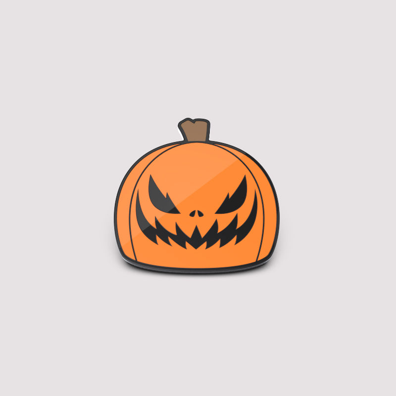 A TeeTurtle Jack-O-Lantern Pin featuring a resting spook face on a white background.