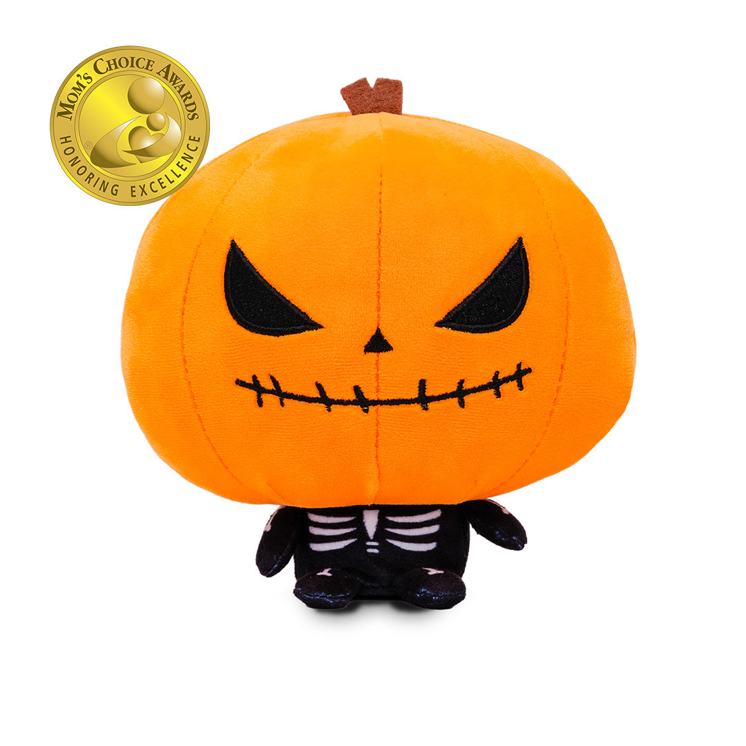 Cloudheads: 5" Pumpkin (Punkin) - A pumpkin headed skeleton plushie with a bright orange head, black stitched eyes and mouth, a small brown stem, and a black-and-white skeleton body. A Mom's Choice Awards badge appears in the top left corner on a plain white background.
