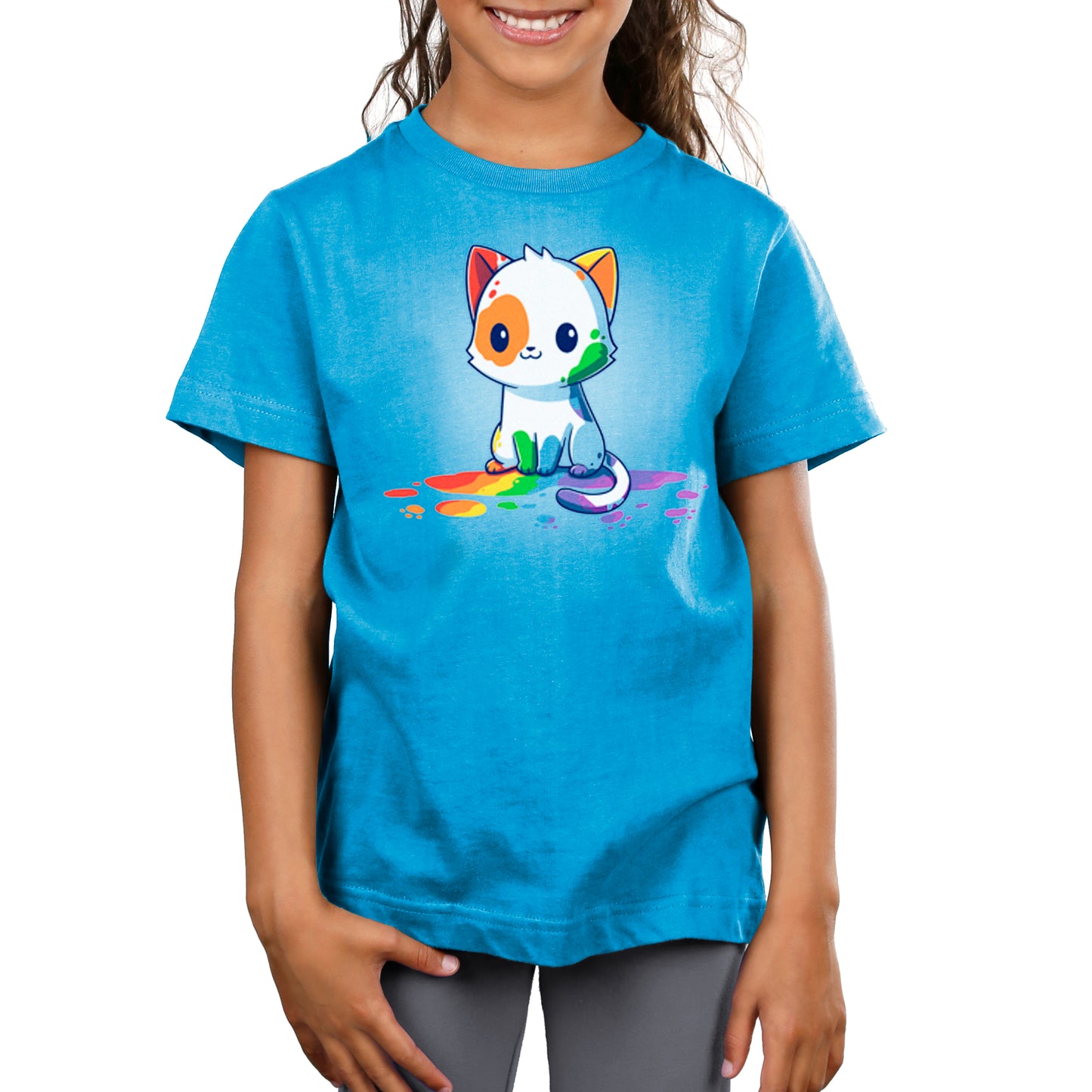 A girl wearing a TeeTurtle Rainbow Cat T-shirt.