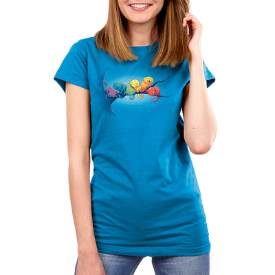 Premium Cotton T-shirt_Teeturtle cobalt blue Rainbow Chameleons apparel featuring a group of six chameleons sitting on a tree branch, each a different color, in rainbow gradient. 