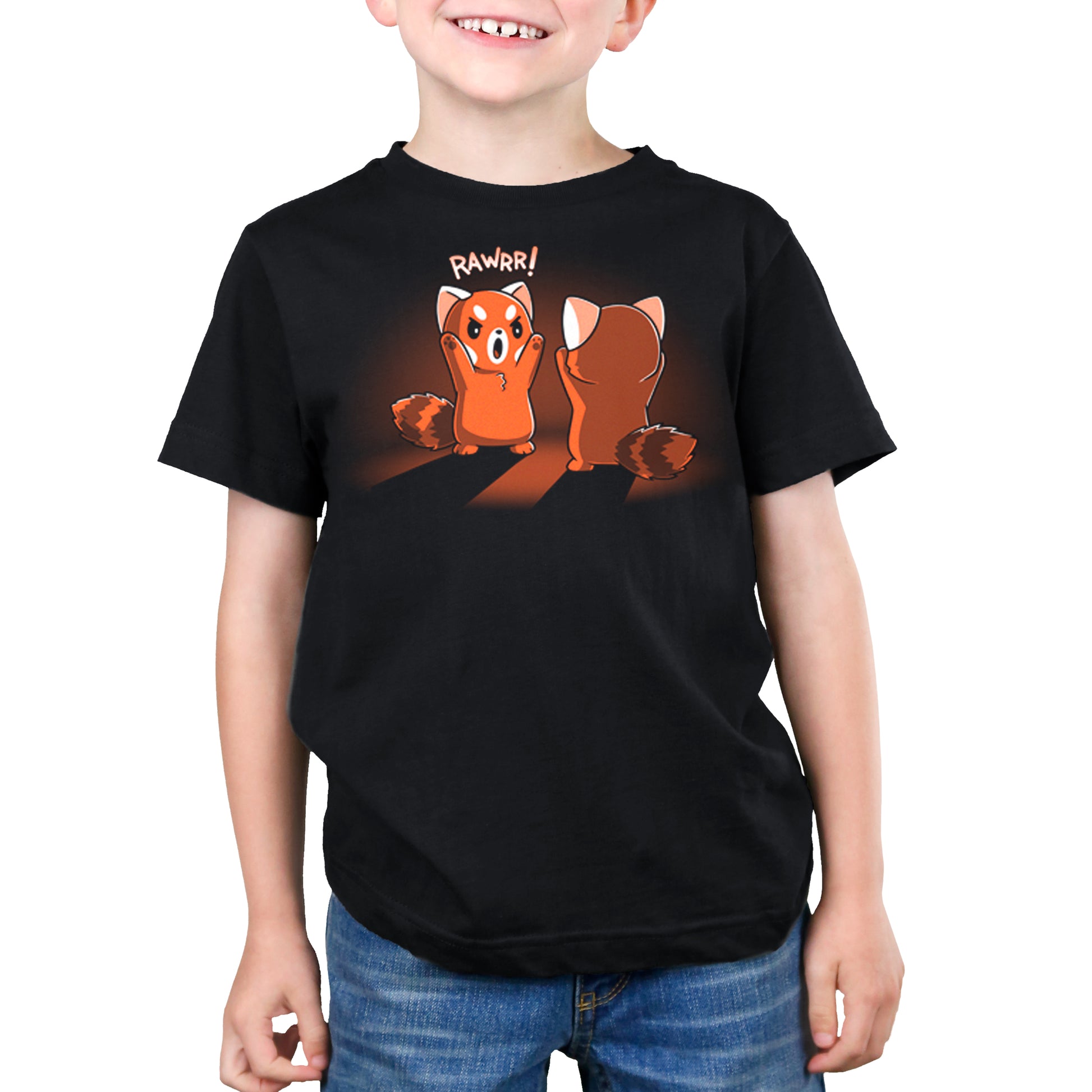 A young boy wearing a TeeTurtle t-shirt with two raccoons on it, showcasing the ferocity of their Rawrr!