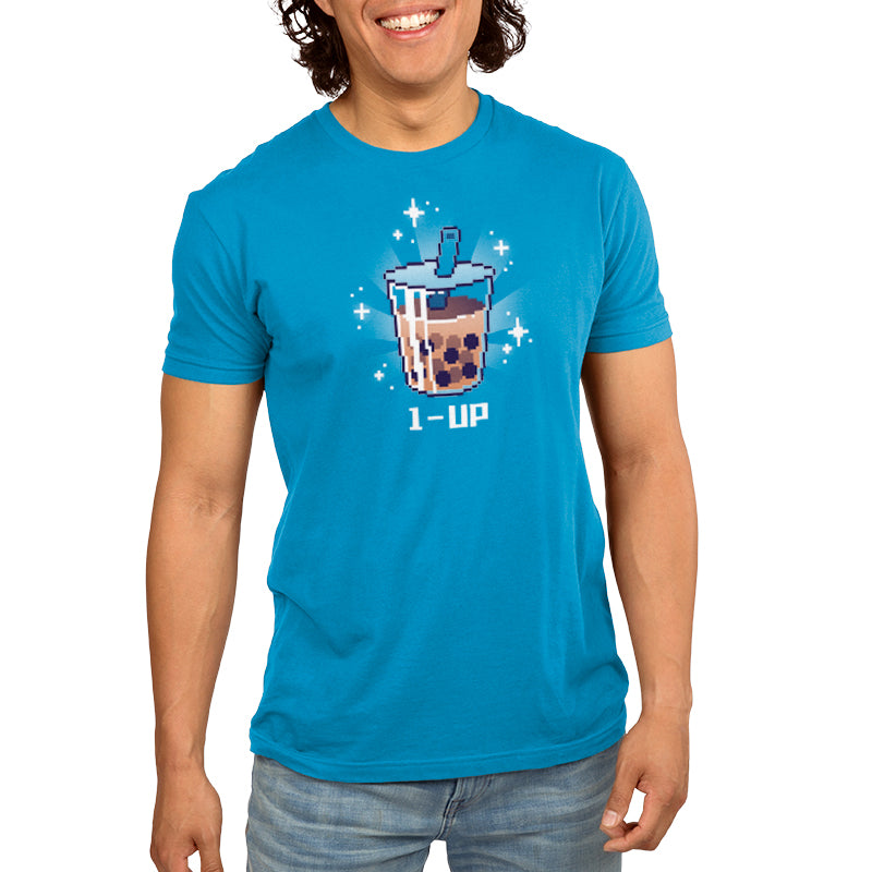 A man wearing a blue t-shirt with a cup of tea, enjoying his TeeTurtle 1-Up Boba.