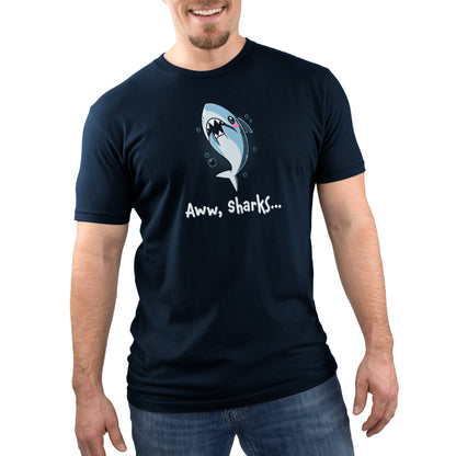 A man wearing a navy blue t-shirt with the Aww, Sharks design by TeeTurtle.