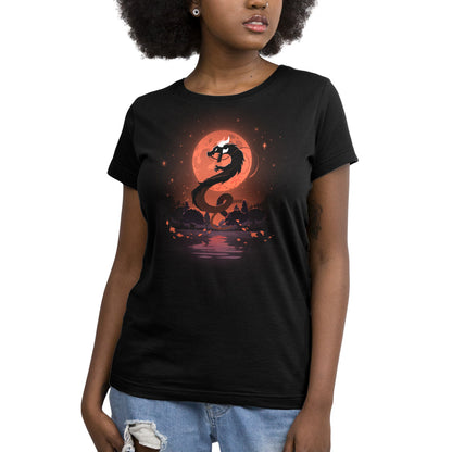 A woman wearing a black t-shirt with an image of the Blood Moon Dragon, representing transformation, from TeeTurtle.