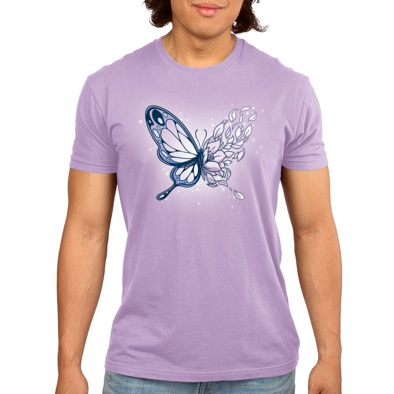 A man wearing a TeeTurtle Blooming Butterfly t-shirt with a butterfly on it.