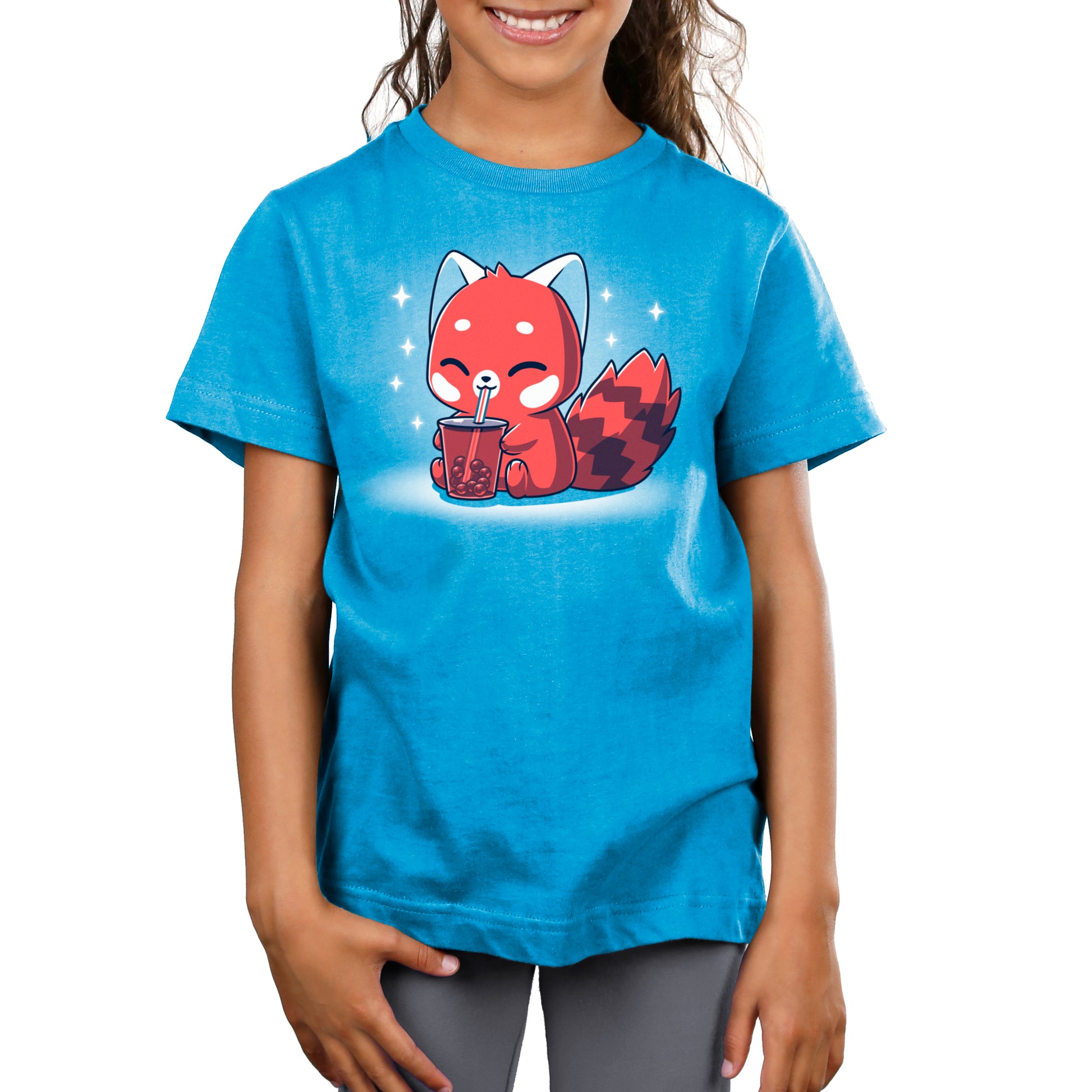 A girl wearing a TeeTurtle cobalt blue t-shirt with a Boba Red Panda on it.