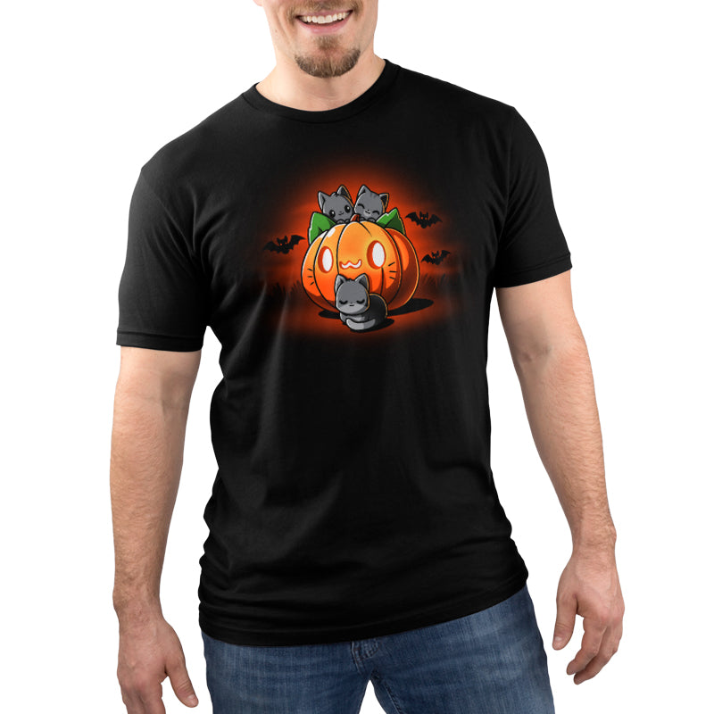 A man wearing a black Cat O'Lantern T-shirt from TeeTurtle for Halloween.