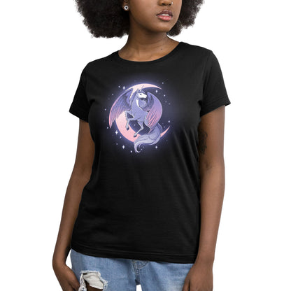 A graceful woman donning a black Celestial Winged Unicorn T-shirt adorned with the beauty of a unicorn on the moon. (Brand Name: TeeTurtle)