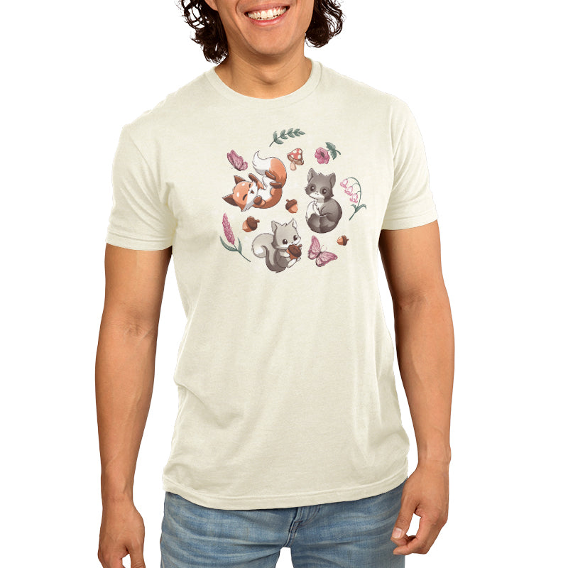 A man wearing a TeeTurtle Cottage Critters t-shirt with furry forest friends and flowers on it.