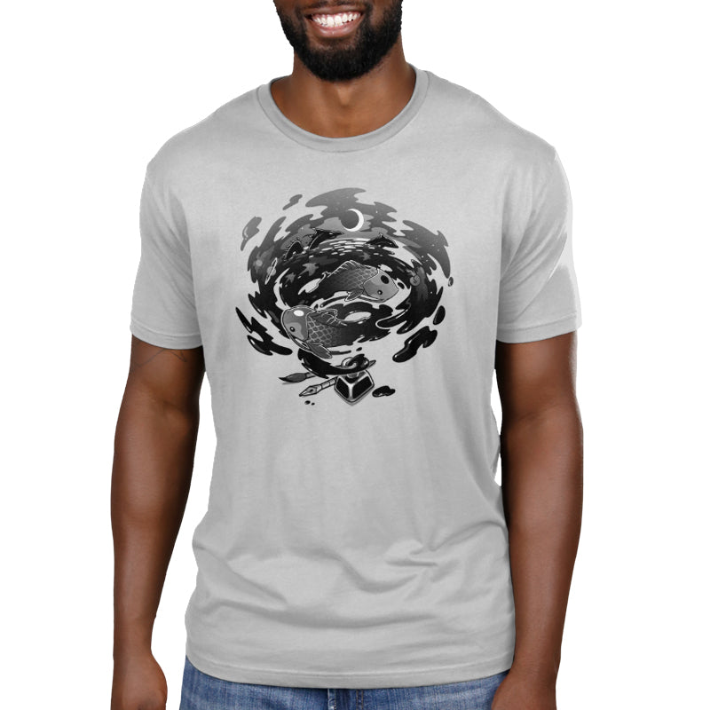 A man wearing a gray t-shirt with a black and white swirl design, showcasing TeeTurtle Creative Flow original artwork.