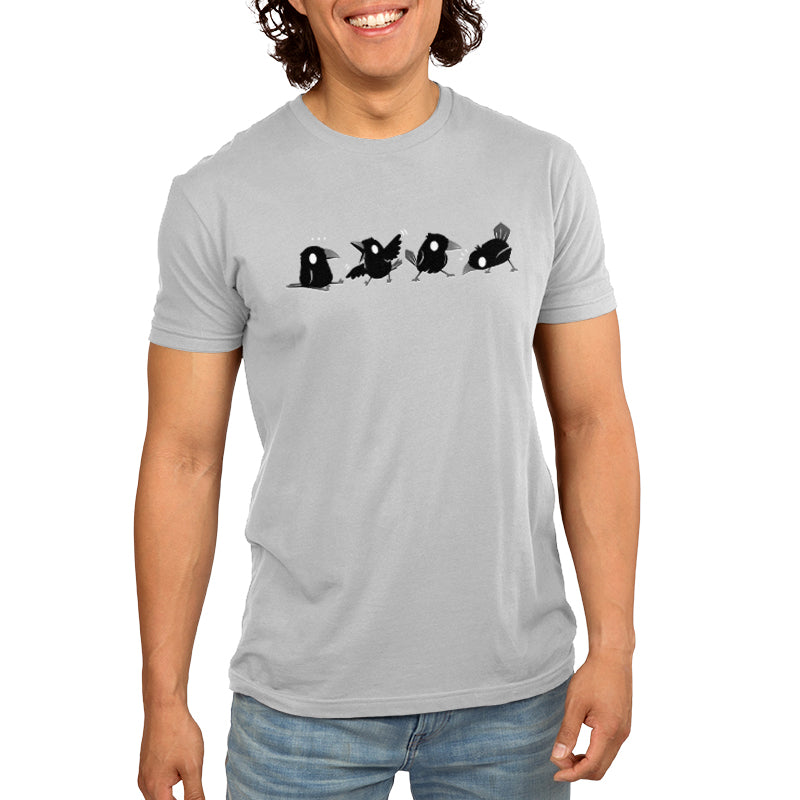 A man smiling and wearing a Crow Chatter T-shirt by TeeTurtle with birds on it.