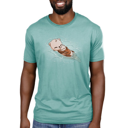 A man wearing a TeeTurtle Cuddly Otters t-shirt with an image of a dog in the water.