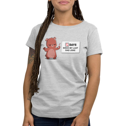 A TeeTurtle women's t-shirt featuring the product Dad Jokes from the brand TeeTurtle, featuring a bear holding a sign.