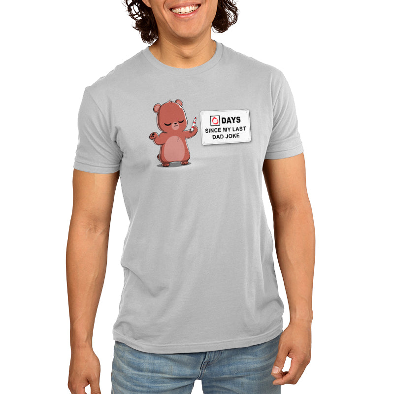 A man wearing a gray T-shirt with a bear on it, showcasing his love for TeeTurtle's Dad Jokes.