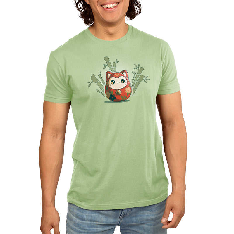 A man smiling at the camera, wearing a TeeTurtle Daruma Kitty T-shirt.
