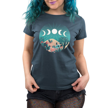 A woman wearing a Desert Moons t-shirt by TeeTurtle, with the moon phases on it, gazing at the stars.