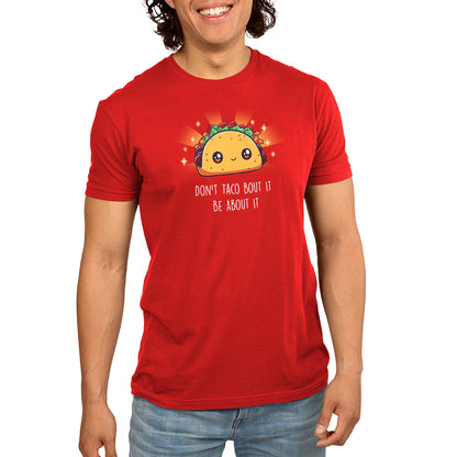 Premium Cotton T-shirt - A person wearing a super soft ringspun cotton, red apparel featuring an illustrated taco with a happy face and the text "Don't taco bout it, be about it." This unisex tee, called "Don't Taco Bout It, Be About It" by monsterdigital, promises comfort and fun vibes.