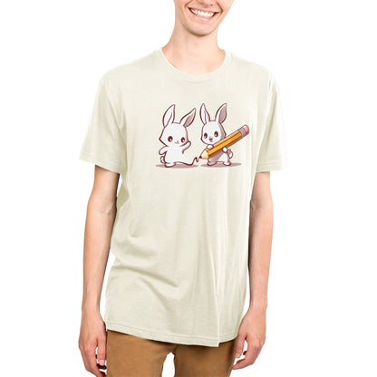 A young man wearing a TeeTurtle Doodle Buddy t-shirt with two rabbits drawn on it.