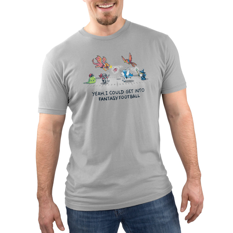 A man wearing a gray TeeTurtle t-shirt with the Fantasy Football cartoon character on it.