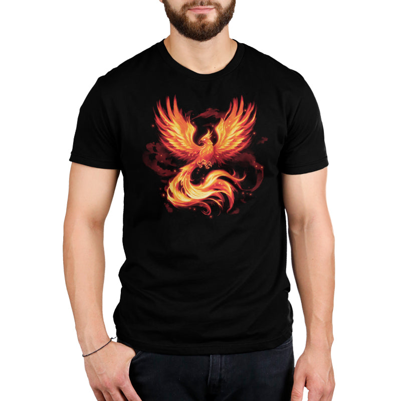 A man wearing a cotton black Fiery Phoenix t-shirt from TeeTurtle.