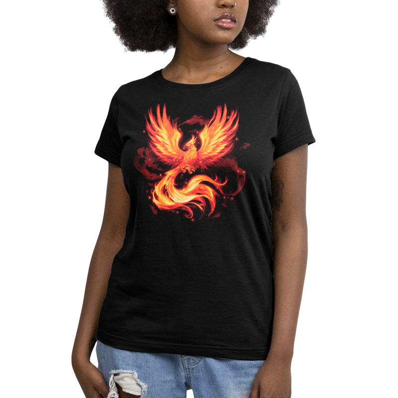 A woman wearing a Fiery Phoenix T-shirt from TeeTurtle with a graphic design on it.