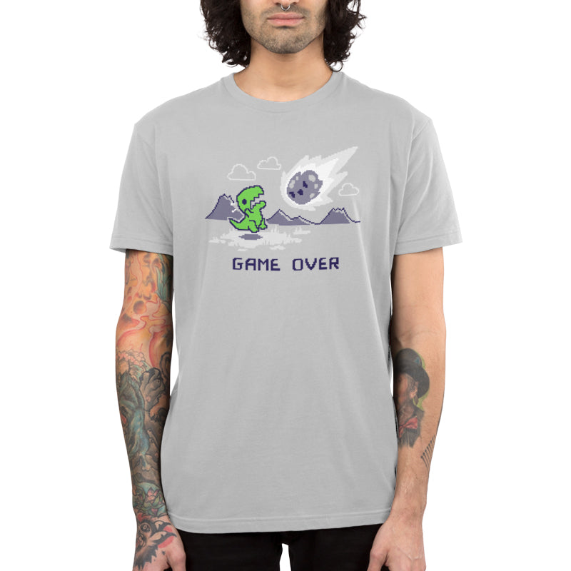 A man wearing a TeeTurtle t-shirt with the Game Over, Dinosaur design on it.