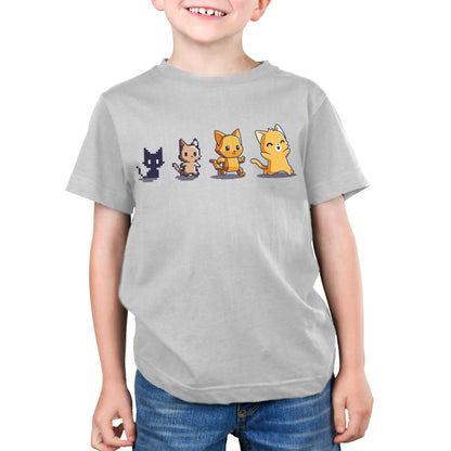 A young boy wearing a TeeTurtle Graphics Evolution t-shirt with cats on it.
