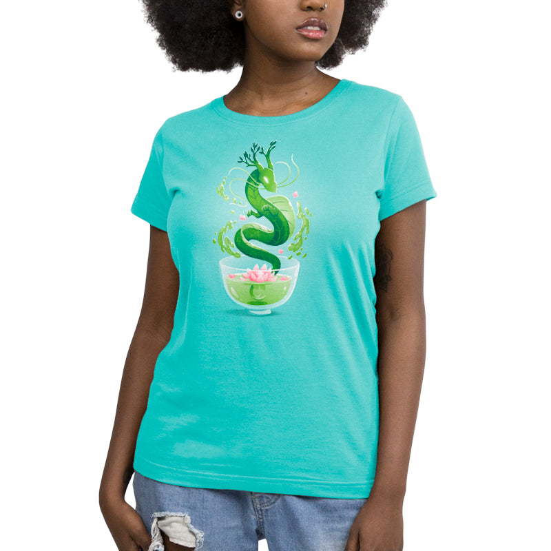 A woman wearing a turquoise t-shirt with an image of a TeeTurtle's Green Tea Dragon in a cup.