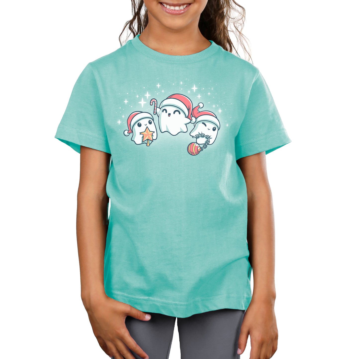A young girl wearing a TeeTurtle T-shirt with three Santa hats.