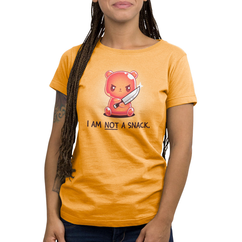 A woman wearing an orange TeeTurtle T-shirt that says "I Am Not a Snack.