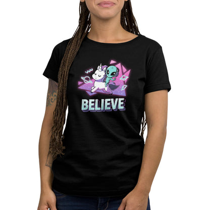 A woman wearing a black "I Believe" t-shirt by TeeTurtle with a fantastical duo-themed design.