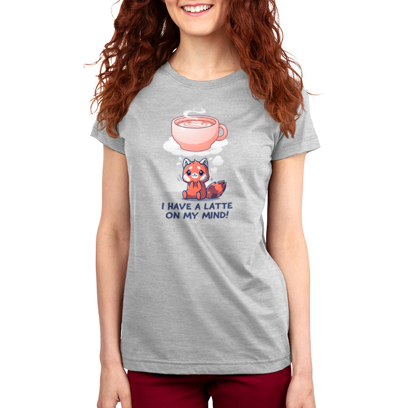 A person wearing a super soft ringspun cotton grey T-shirt featuring an illustration of a red panda and a latte with the text "I Have a Latte on My Mind!" from monsterdigital.