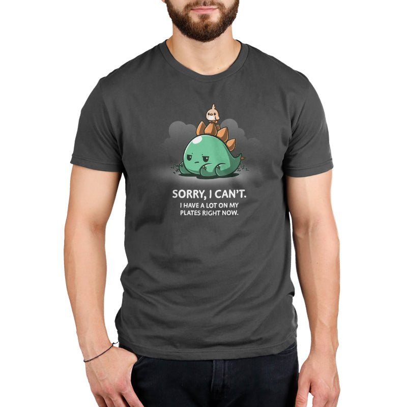 A man wearing a charcoal gray T-shirt with the words "I Have A Lot On My Plates" by TeeTurtle.