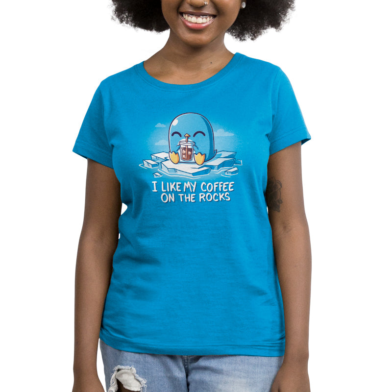 A woman wearing the "I Like My Coffee on the Rocks" t-shirt from TeeTurtle.