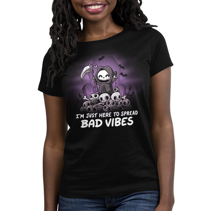 A black women's t-shirt from TeeTurtle called "I'm Just Here to Spread Bad Vibes" that boldly spreads bad vibes.