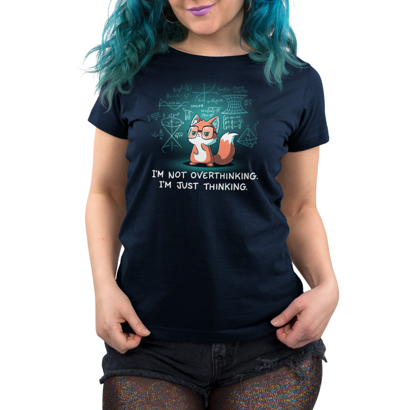 A woman wearing a navy blue t-shirt with a casual fit that says "I'm Just Thinking" by TeeTurtle.