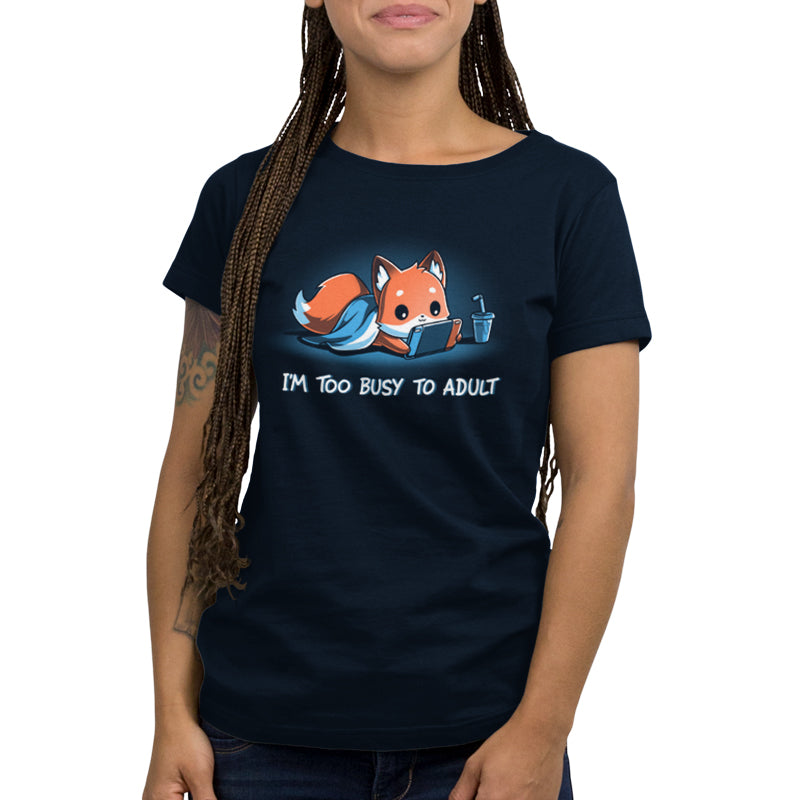 A woman wearing a TeeTurtle navy blue "I'm Too Busy to Adult" t-shirt.