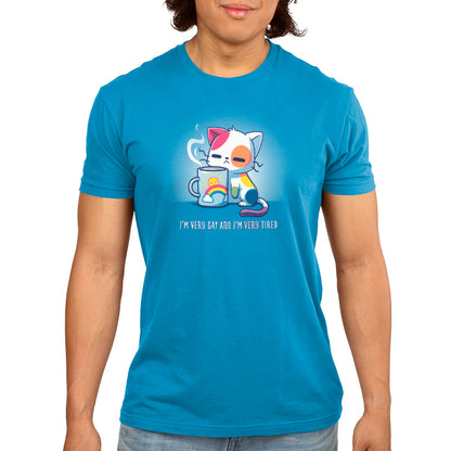 A man wearing a TeeTurtle cobalt blue t-shirt with a cat on it.