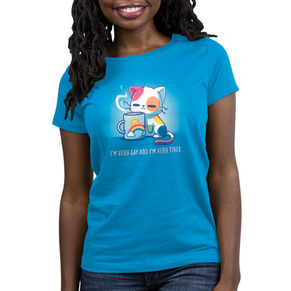 A woman wearing a TeeTurtle cobalt blue t-shirt with a cat on it, enjoying her morning coffee.