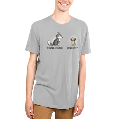A young man wearing a TeeTurtle "It's Going Great" T-shirt with a cute pup and a cat.
